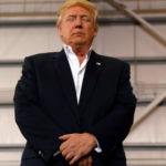 U.S. President Donald Trump bows his head in prayer during a "Make America Great Again" rally at Orlando Melbourne International Airport in Melbourne, Florida, U.S. February 18, 2017.  REUTERS/Kevin Lamarque