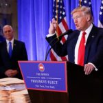 Vice President-elect Mike Pence is seen in the background as U.S. President-elect Donald Trump speaks during a press conference in Trump Tower, Manhattan, New York, U.S., January 11, 2017. REUTERS/Shannon Stapleton